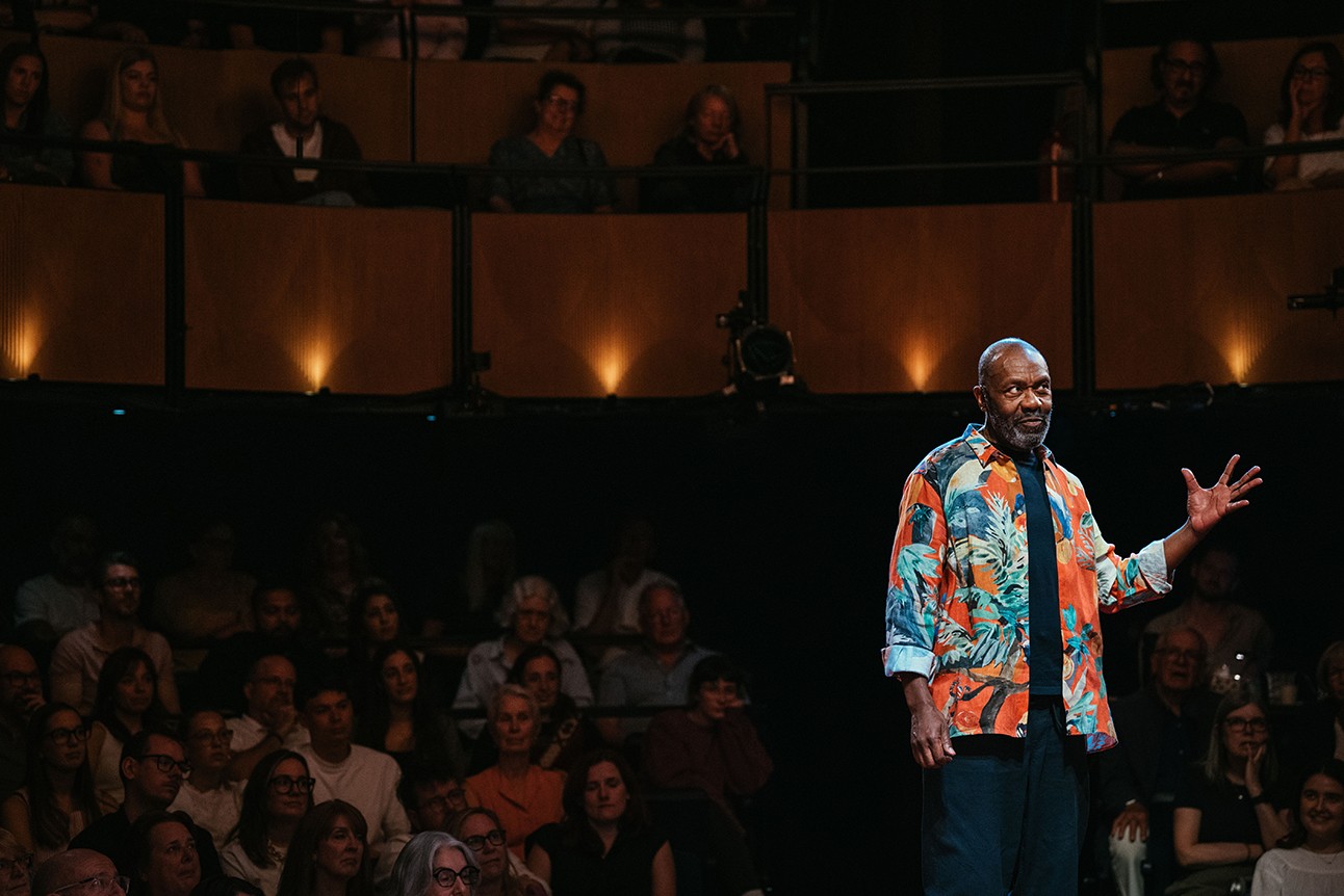 Lenny Henry performing on stage at Soho Place, with vibrant lighting and an engaged audience.
