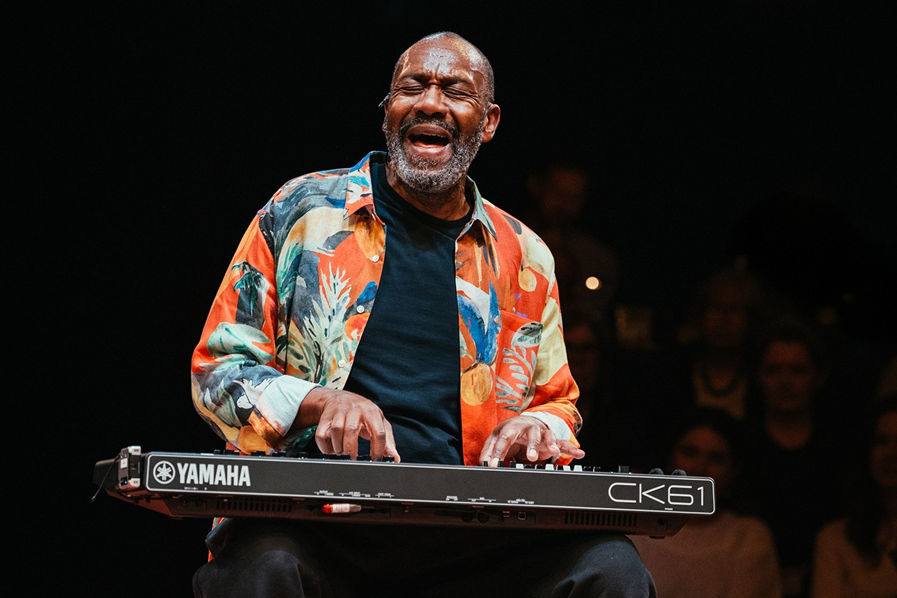 Lenny Henry performing on stage at Soho Place, with vibrant lighting and an engaged audience.