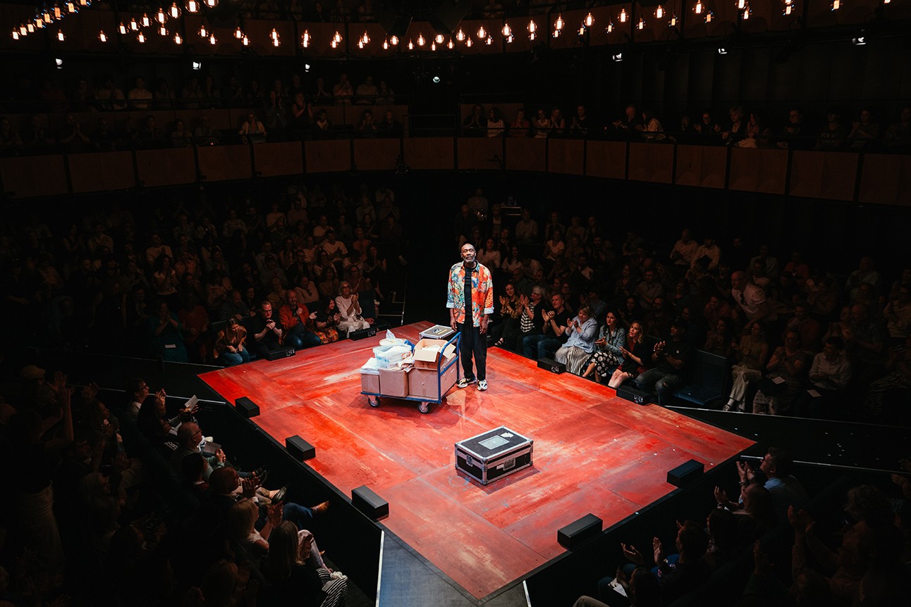Lenny Henry performing on stage at Soho Place, with vibrant lighting and an engaged audience.