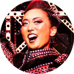 Nimax buttons featuring various colourful heads displayed against a neutral background.