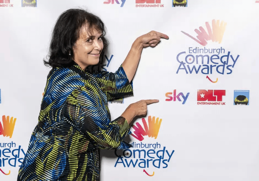 Nica Comedy Awards logo featuring a stylised microphone and vibrant colours on a dark background.
