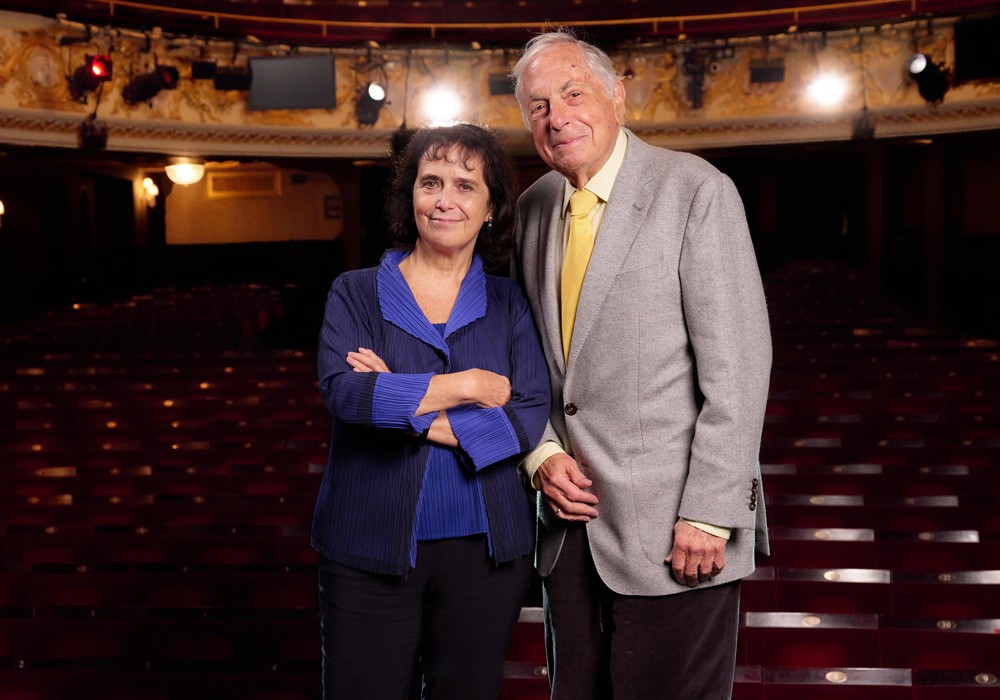 Nica Burns and Max Weitzenhoffer smiling together at an event, dressed in formal attire.